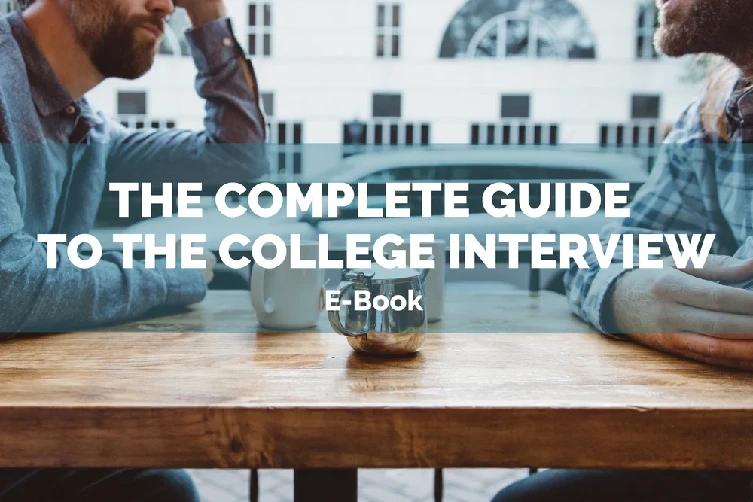 Two people sit across from each other at a wooden table with coffee mugs. Text overlay reads, "The Complete Guide to the College Interview E-Book.