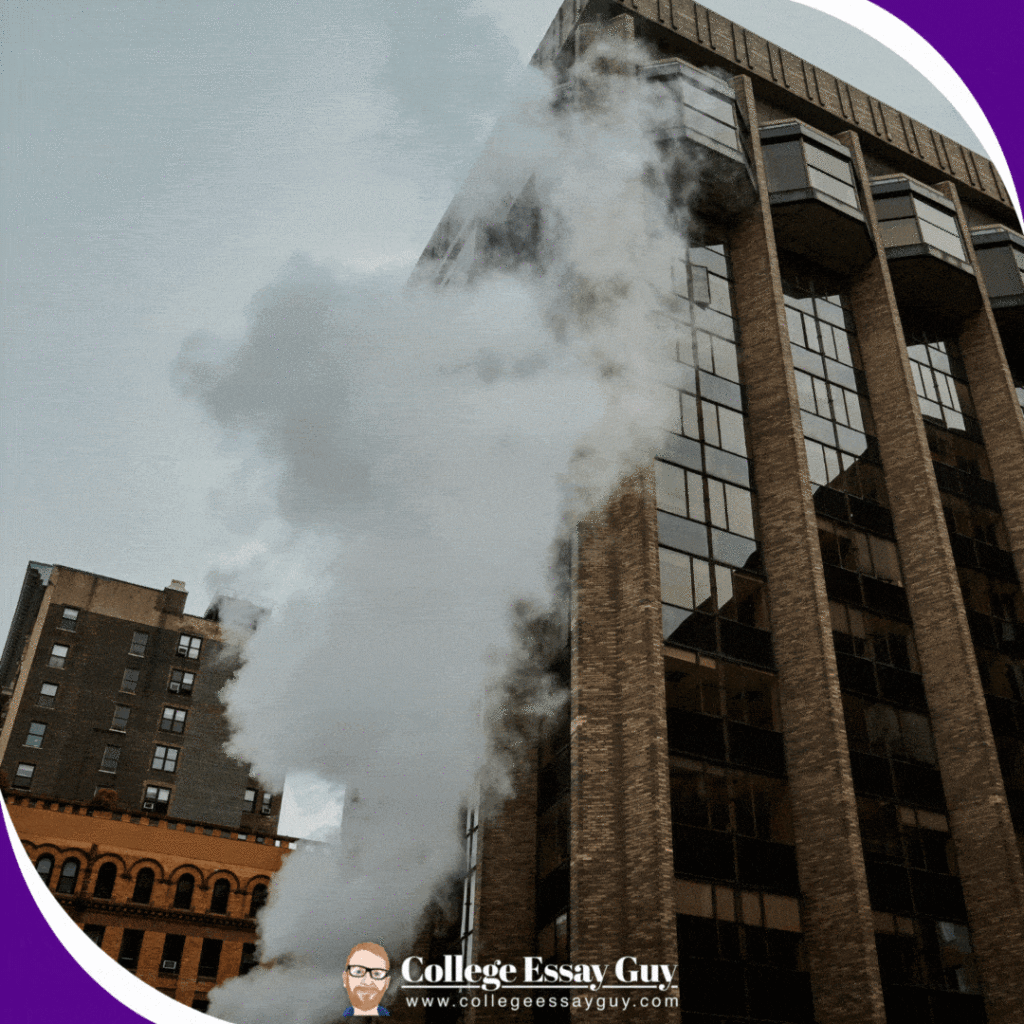 Steam rises beside high-rise buildings in an urban area, with the College Essay Guy logo and website address visible at the bottom of the image.