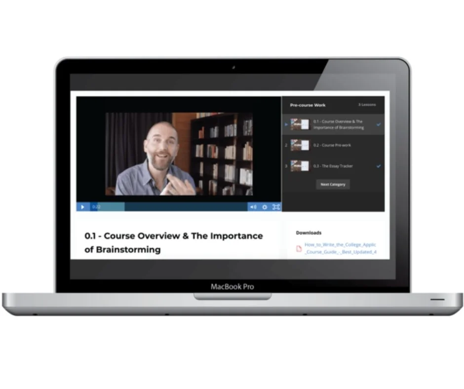 A MacBook Pro displays an online course video titled "Course Overview & The Importance of Brainstorming," featuring an instructor speaking in front of a bookshelf.