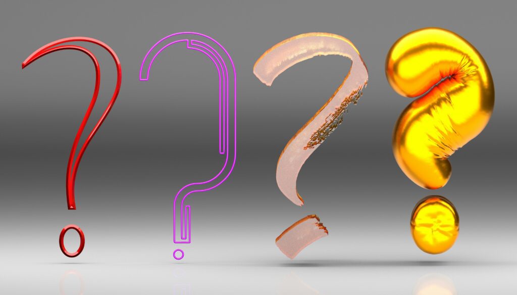 Four stylized question marks in different materials—red glass, neon pink, metallic rose gold, and shiny gold—are displayed side by side on a neutral background.